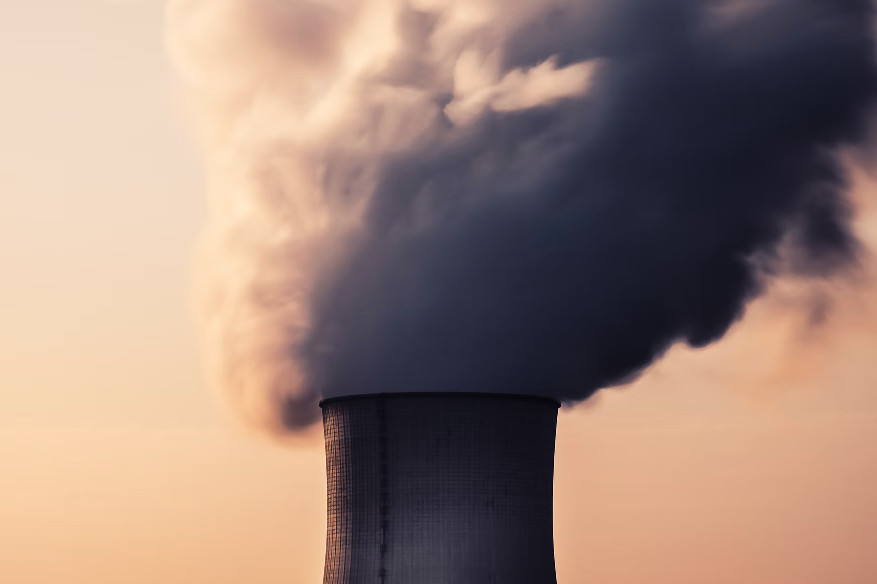 Picture of power station smokestacks with smoke  and steam coming out